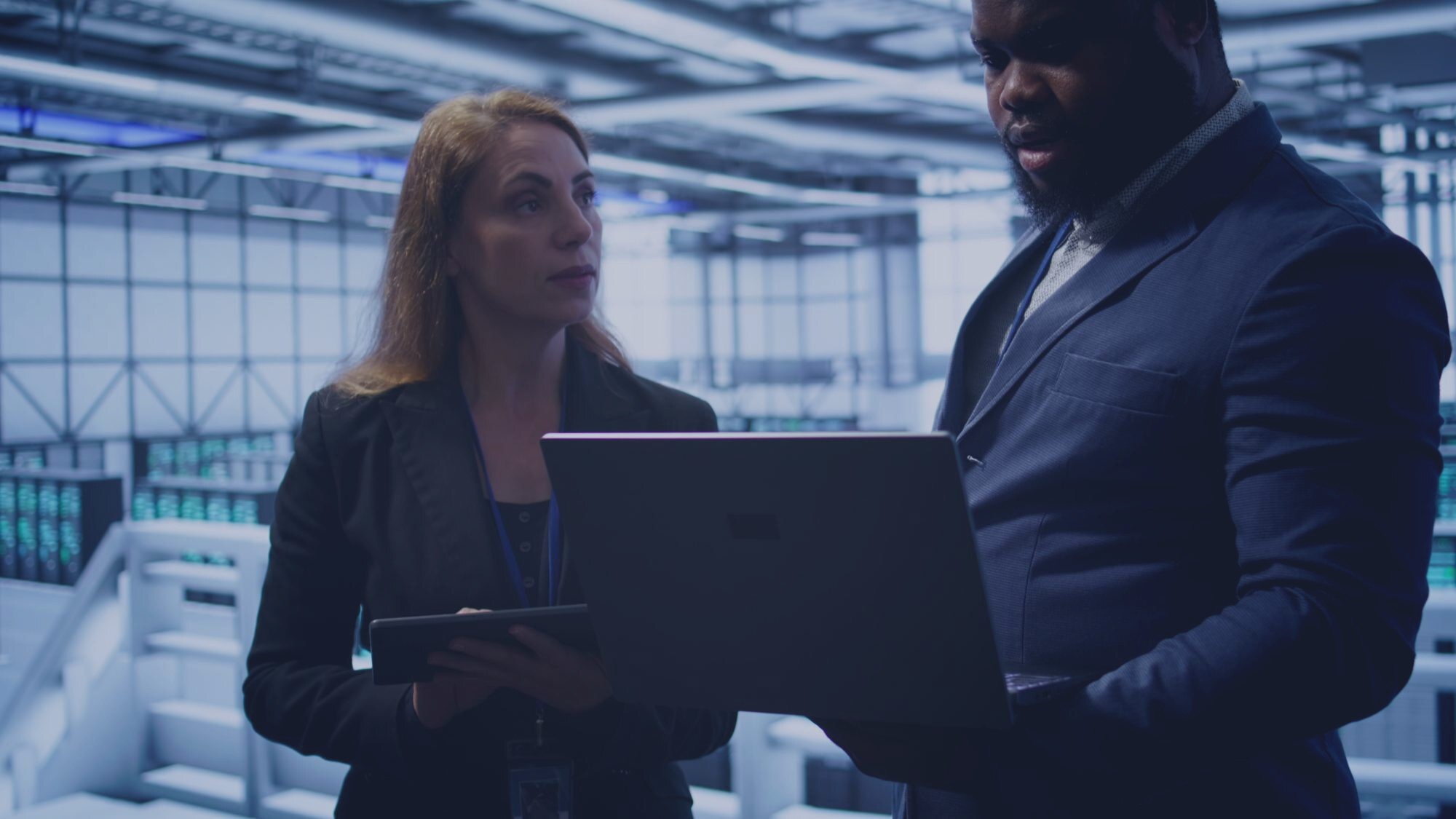 Technology professionals collaborating in a dark enterprise environment