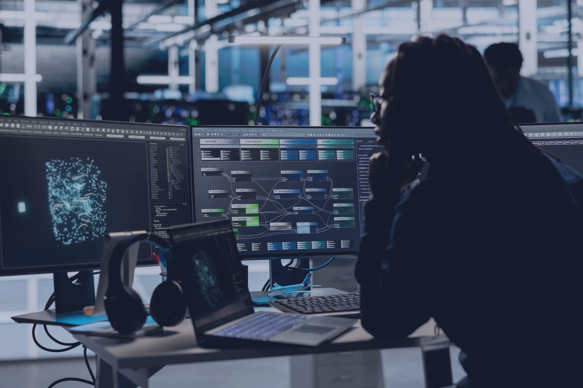 Senior machine learning engineer at a dark workstation