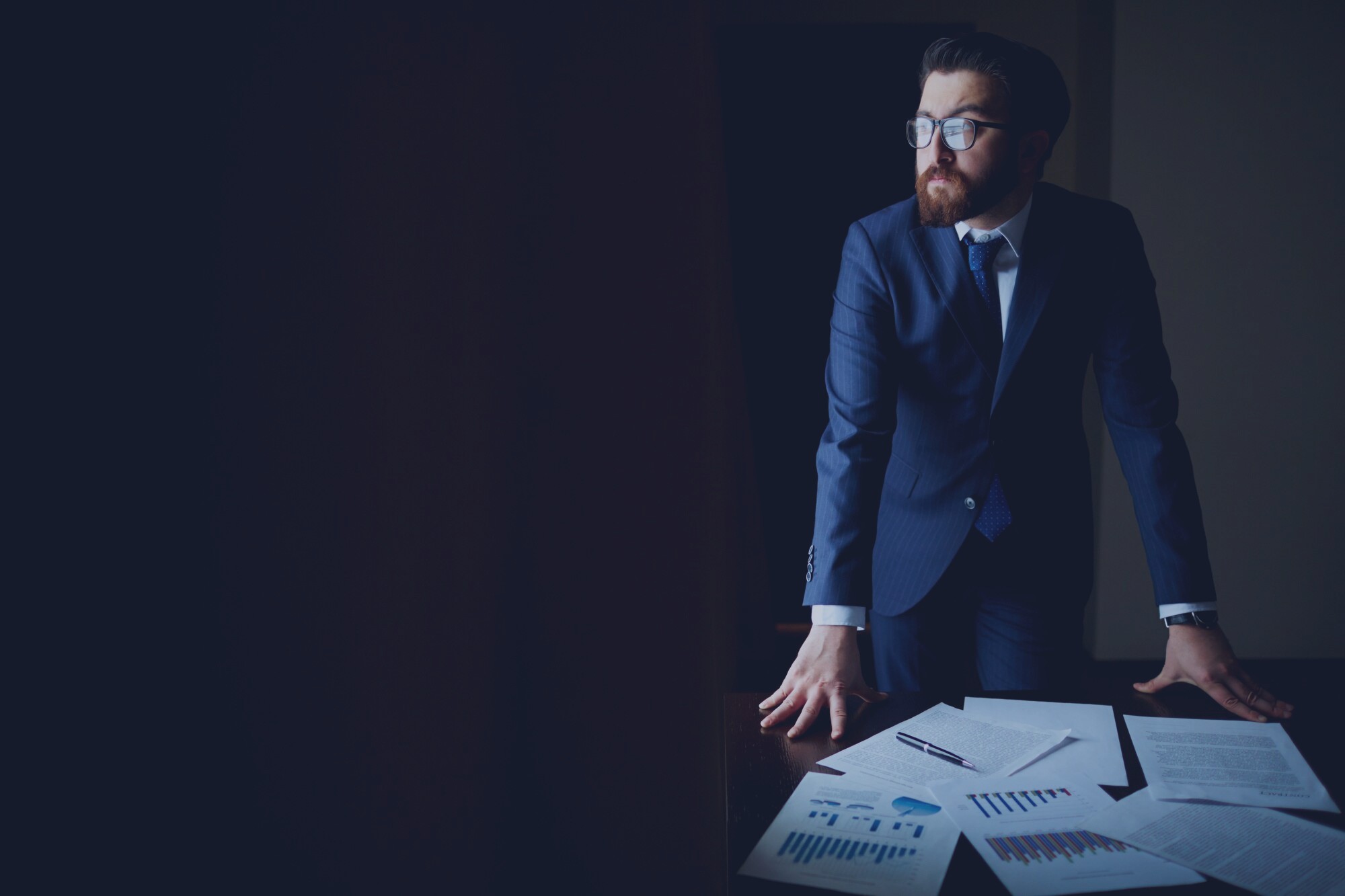 Investment team in a dark financial enterprise setting