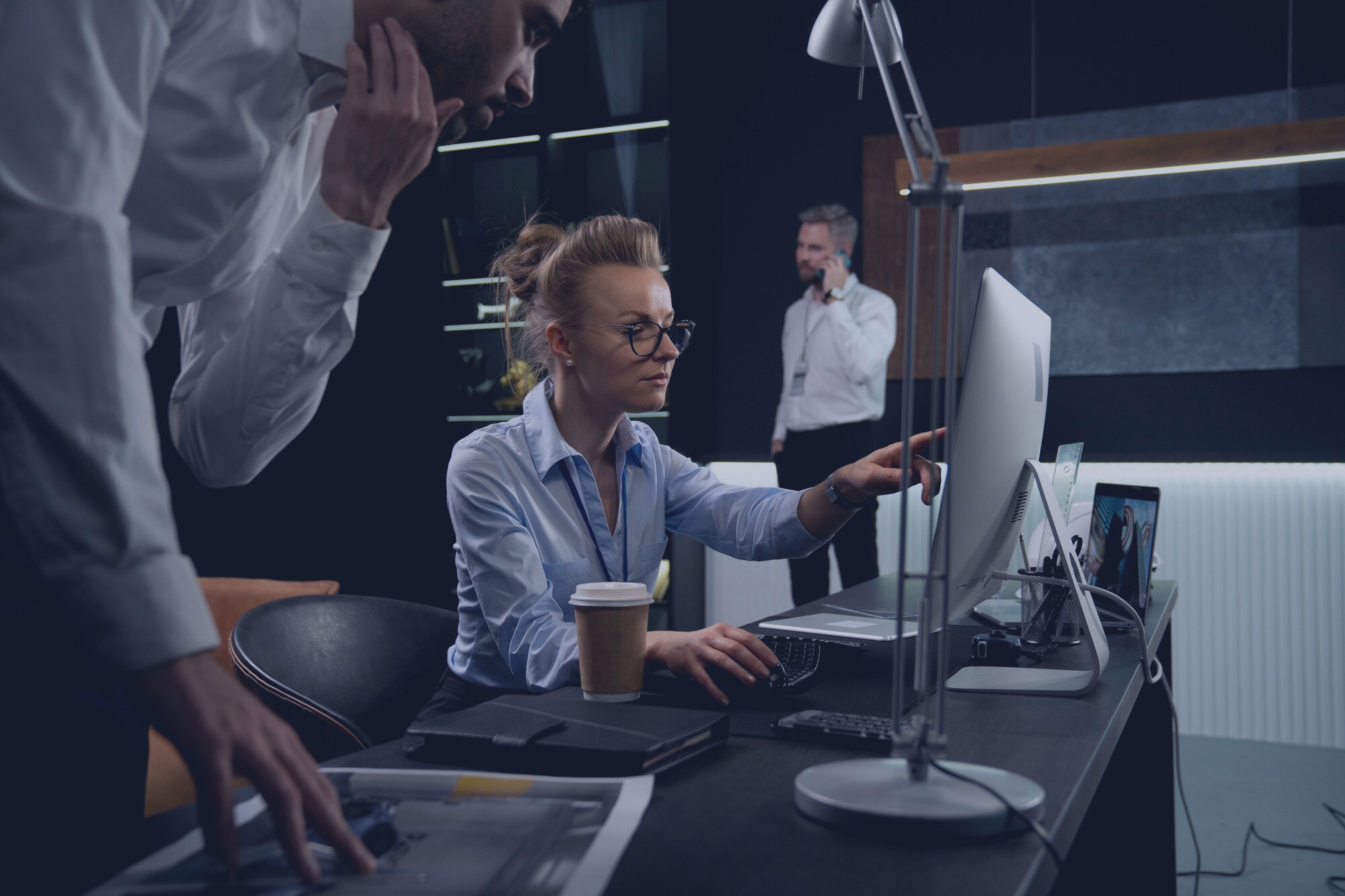 Enterprise software engineering team in dark agile workspace